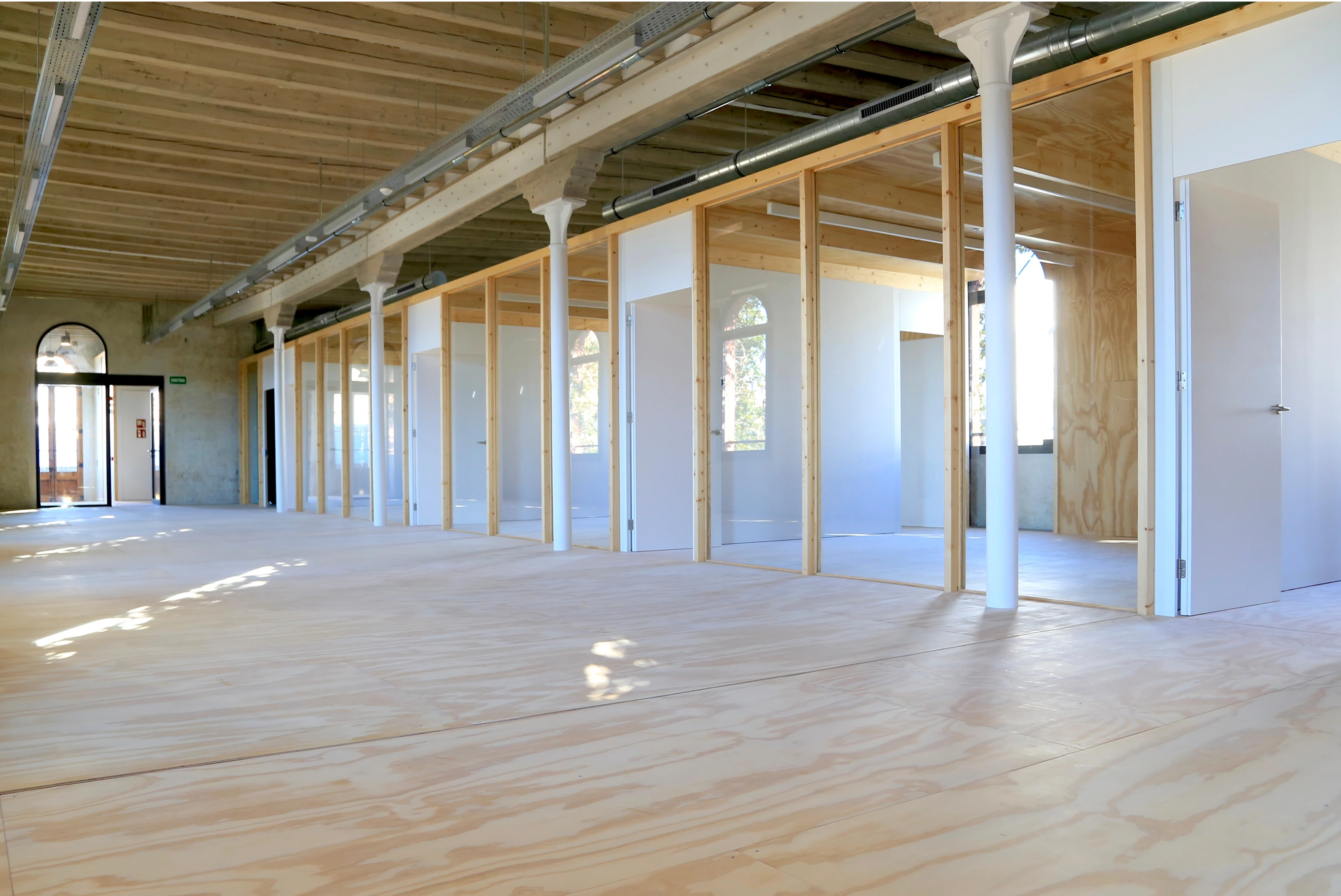 Construction site interior with arched windows